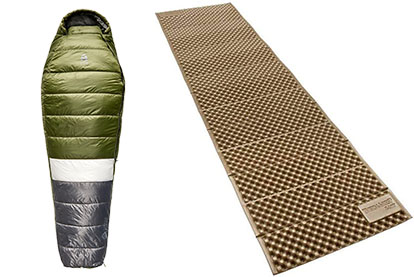 A green, white, and gray mummy-style sleeping bag is shown next to a brown, foldable foam sleeping pad with an egg-crate texture, both designed for camping.